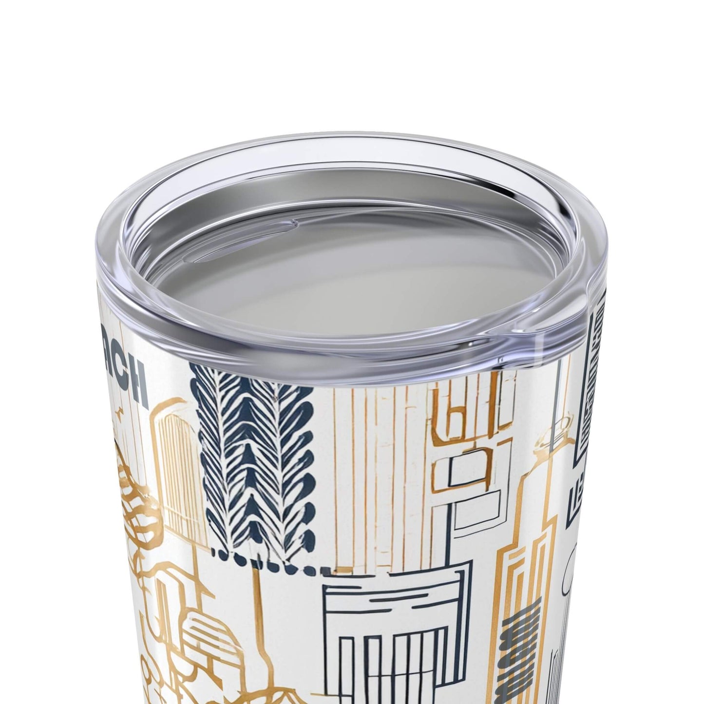 Clear tumbler with geometric pattern and silver lid on a white background close up