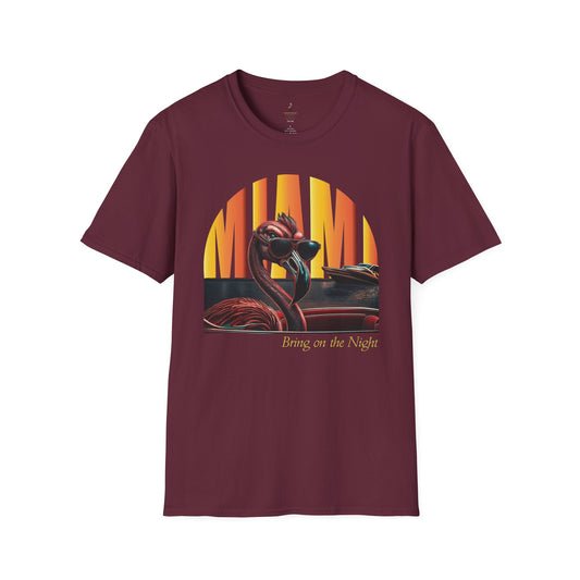 A maroon t-shirt featuring a retro graphic print of a cool flamingo wearing sunglasses with a Miami sunset background.